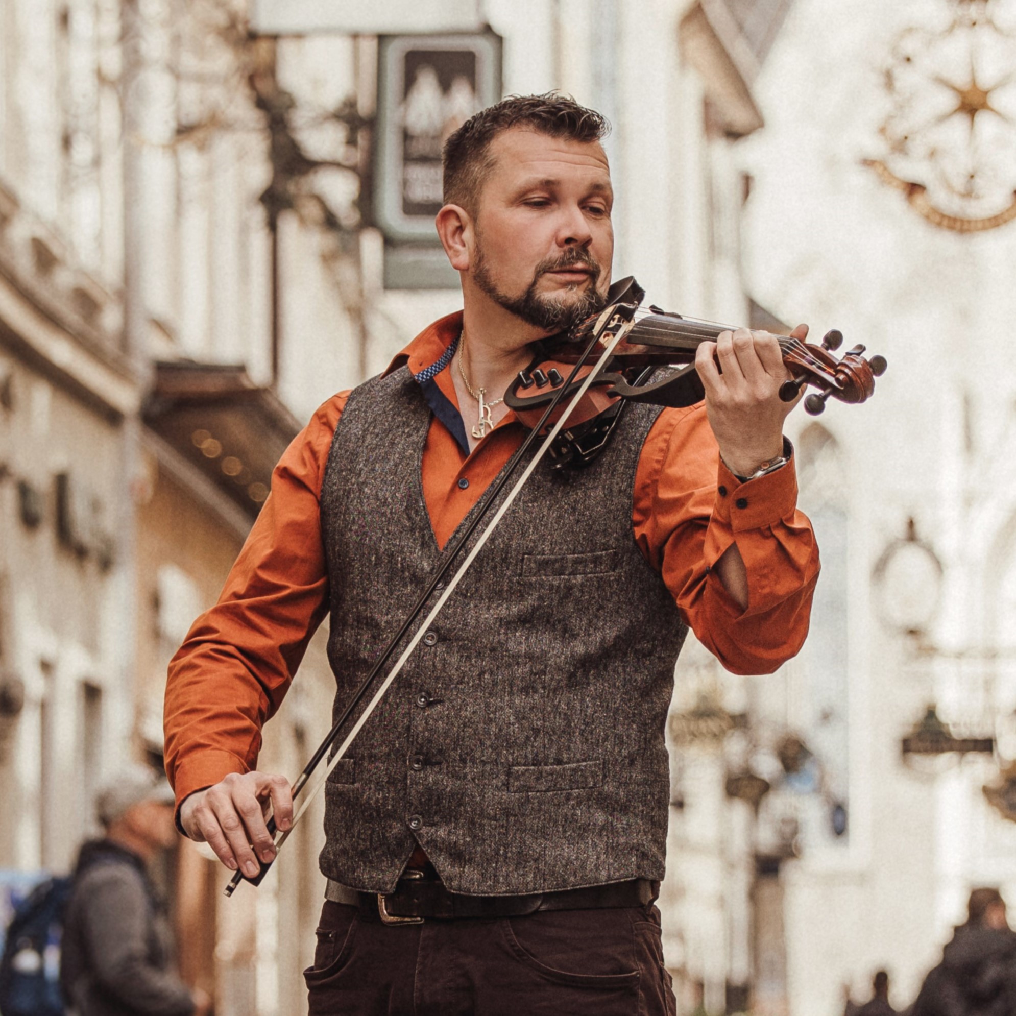 Jan Fila playing violin in the street